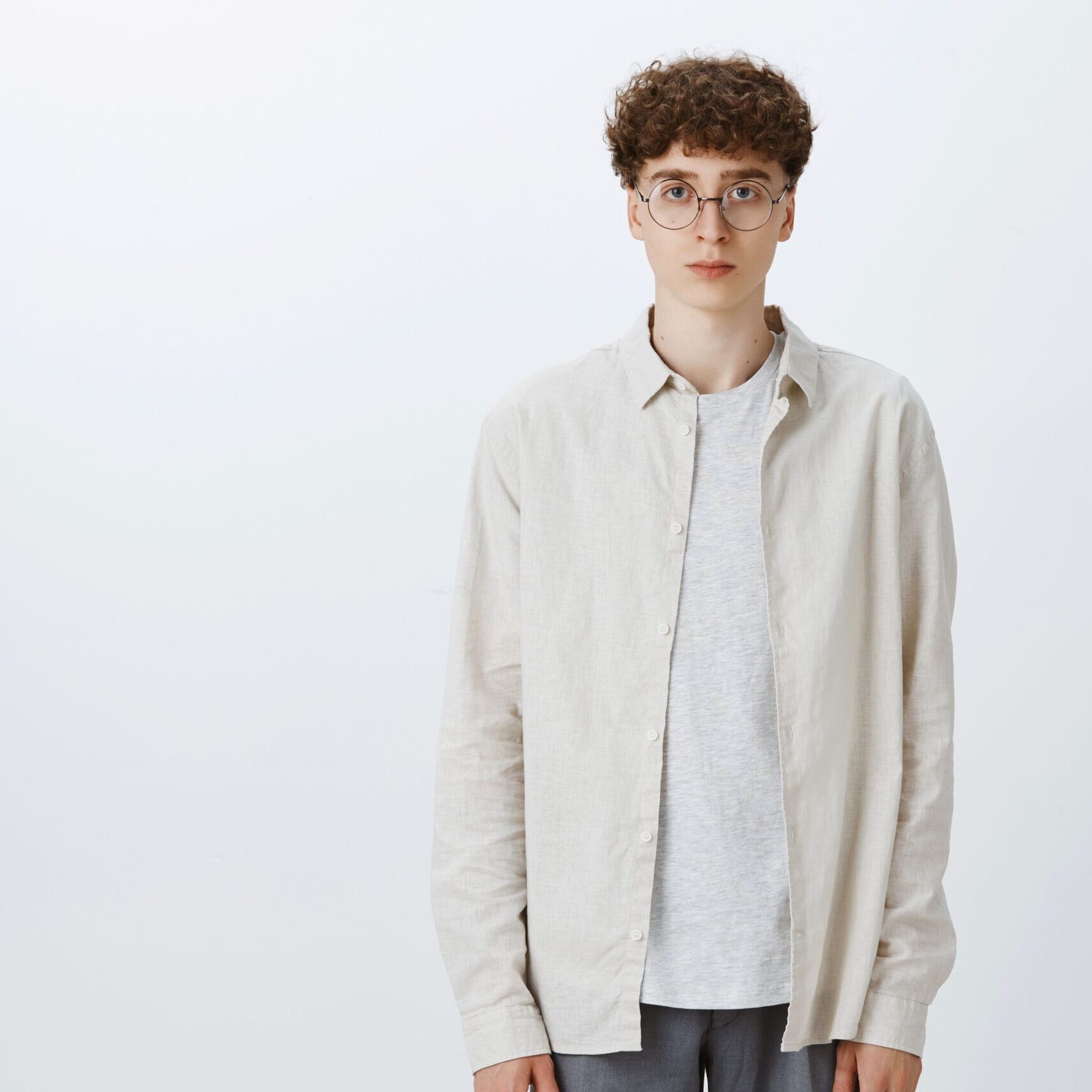 attractive-stylish-young-boy-glasses-looking-serious