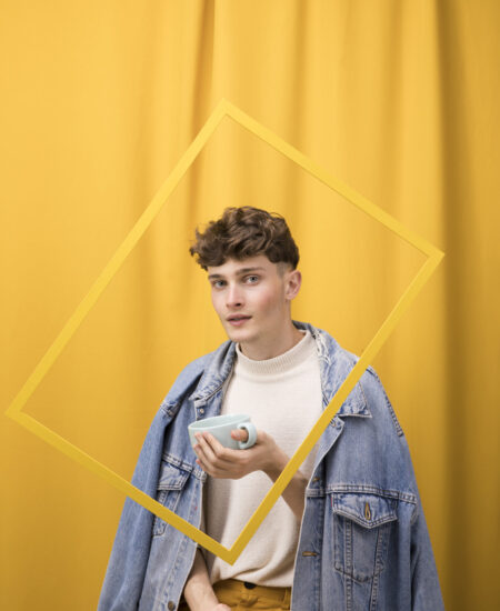 portrait-fashionable-boy-drinking-within-frame